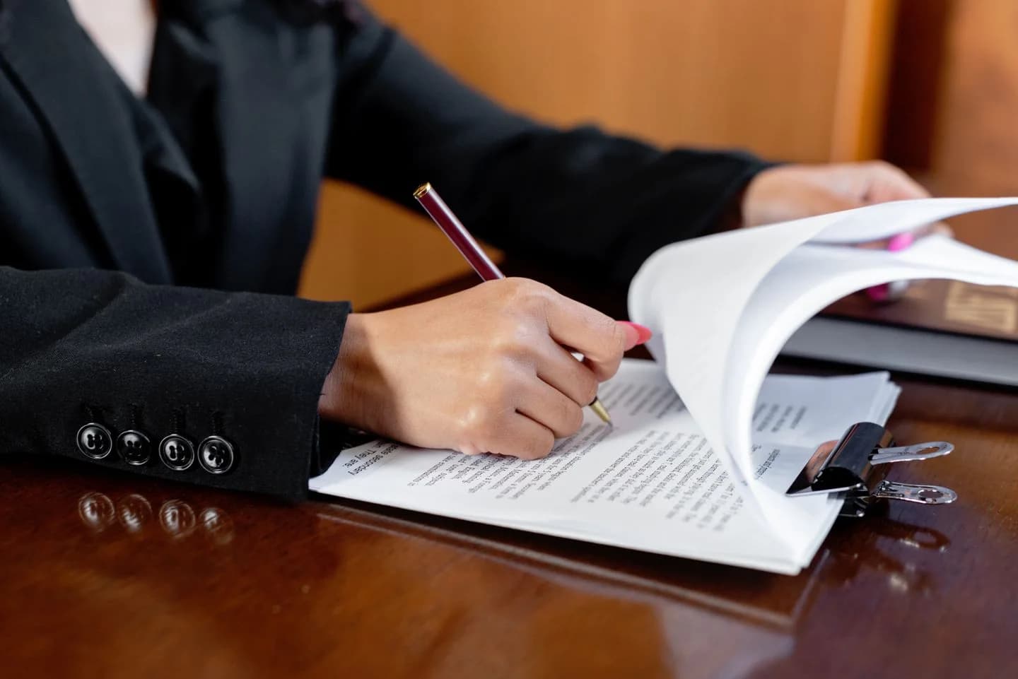 A professional reviewing and preparing documents.