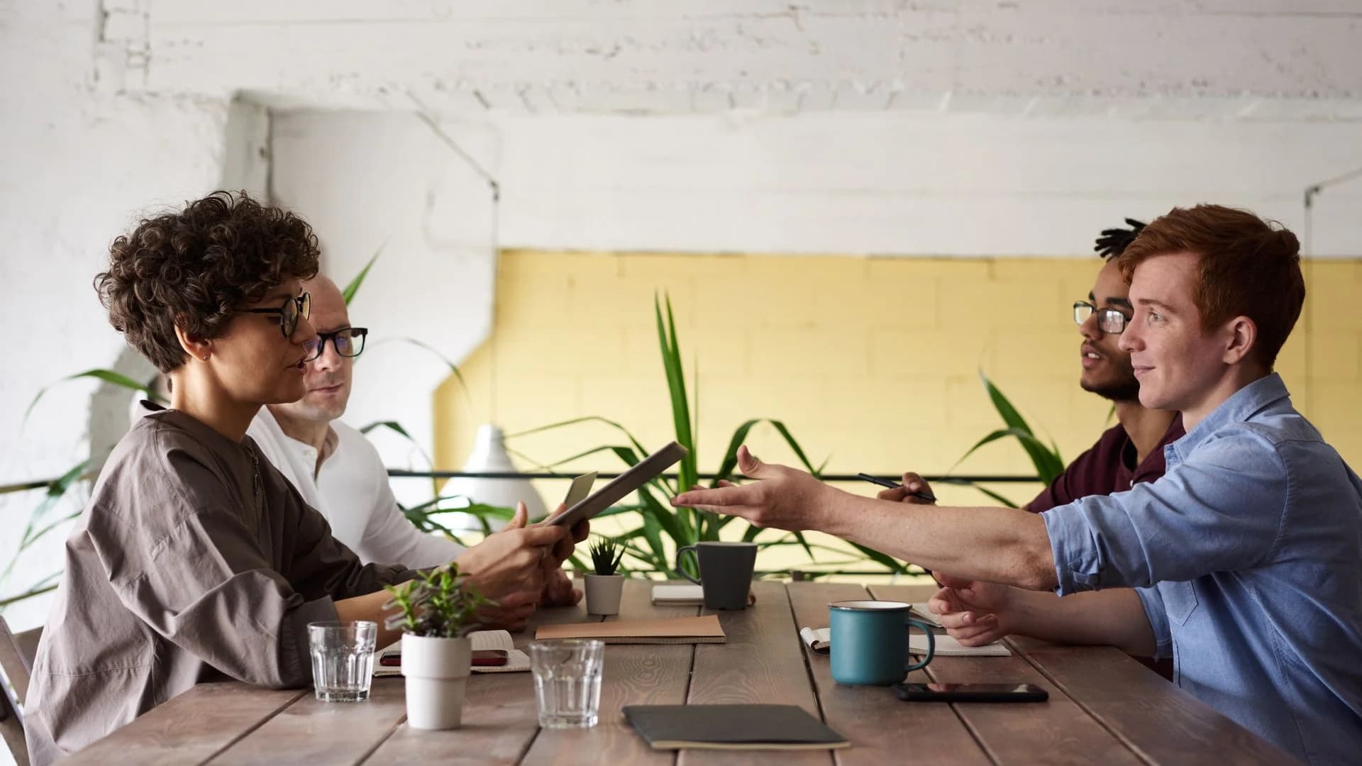 Professionals collaborating around a table.